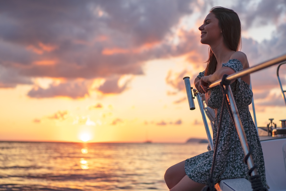 Woman enjoying the sunset on a St. Thomas Charter Boats cruise.